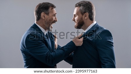 rival business company. businessmen having rivalry. rivalry in the business world. historic rivalry. rival strategy of businessmen isolated on grey. business competition and rivalry