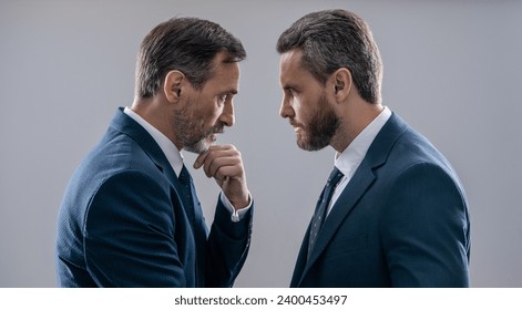rivalry in the business world. rival strategy of businessmen isolated on grey. business competition and rivalry. rival business company. businessmen having rivalry. making serious decision
