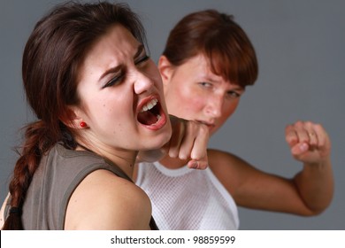 Rivalry Girls - Brutal Face Punch Over Grey Background