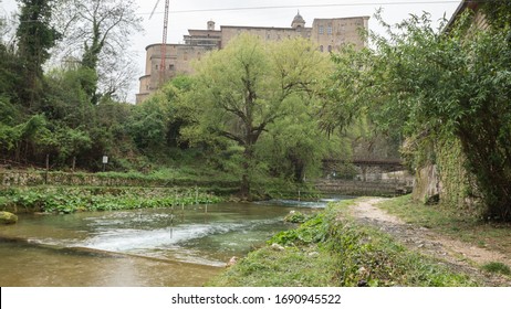 The River Aniene With Canoe Slalom Poles, Under The Basilica Of Saint Andrew The Apostle In Subiaco, Italy.