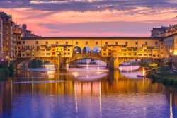 River Arno And Famous Bridge Ponte Vecchio At Sunset From Ponte Alle Grazie In Florence, Tuscany, Italy