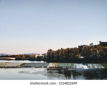 River Arno is the second most important river in central Italy after Tiber. The shot was taken from Tuscany, Italy. The river has trees behind it giving extra details to the picture. 