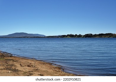 A River Bank With Water Waves With Mountain View Background At Murray River In South-eastern Australia. 