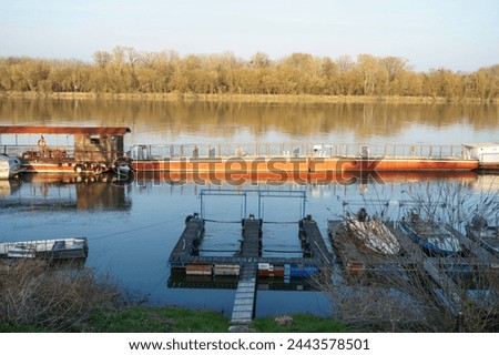River barge and boat docks in the afternoon sun