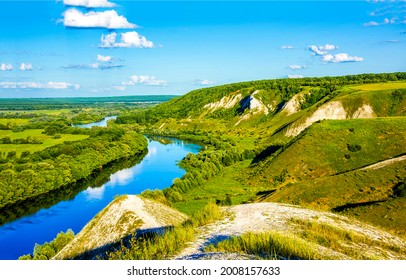 A river bend in a mountain river valley - Shutterstock ID 2008157633