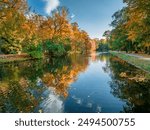 River Brda and colorful trees in Bydgoszcz at autumn, Poland. Polish golden autumn in nature.