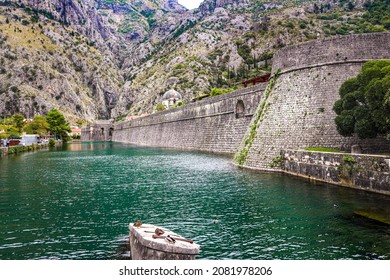 River canal near the fortress of the old town of Kotor. Montenegro, Balkans. The mountains.