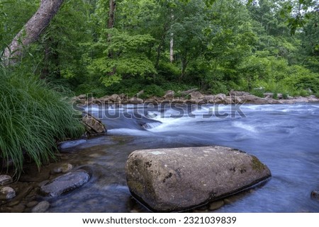 River in Cherokee North Carolina showing a rock close to the water’s edge