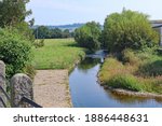 The river Coly flows slowly out of Colyton, Devon southwards towards Colyford and on to join the river Axe where it reaches the sea at Axmouth