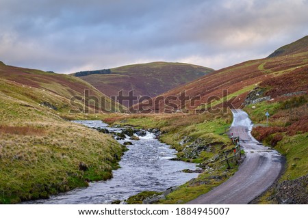 River Coquet flows down Upper Coquetdale, a remote valley, located in the Cheviot Hills close to the Scottish Border in Northumberland National Park