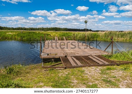river crossing in the form of a movable floating metal bridge