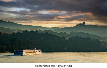 A River Cruise Boat On The Danube River At Sunset, In The Melk District, Lower Austria Near Sausenstein