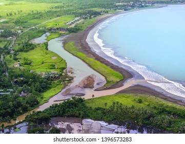 River Delta Meet The Blue Calm Ocean. Muddy River Flow Its Sediment Into Seashore Or Beach. Aerial View Of Ciletuh Bay At Sukabumi Pelabuhanratu