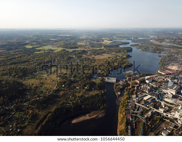 River\
dividing garden plots and factory - aerial\
view