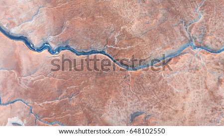 Similar – Image, Stock Photo Drone view of dry rough terrain with rocky formations