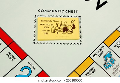 RIVER FALLS,WISCONSIN-FEBRUARY 05,2015: A Corner Of A Monopoly Board Showing The Community Chest Cards.