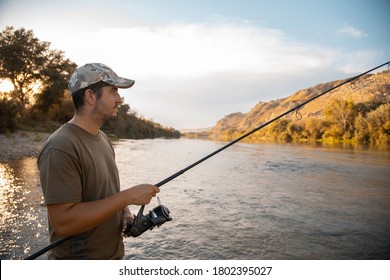 River Fisherman With Fishing Rod