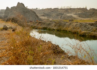river flow between limestone mountains