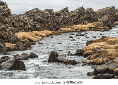 Öxará river flowing between massive tectonic plates in Thingvellir National Park in southwestern Iceland, Europe