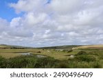 river flowing through the seven sisters country park into the ocean, England