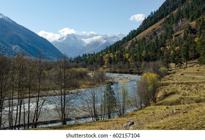 The river flows between the mountains