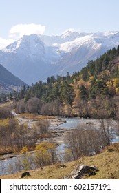 The river flows between the mountains