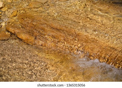 the river flows in the mountains in spring