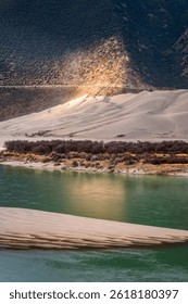 The river flows through the mountains