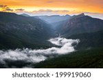 River of fog along the Linville River in the gorge. Taken around sunrise from atop Shortoff Mountain. 