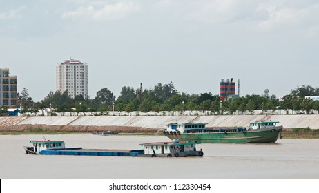 River Freight Vessels Meeting On Tonle Sap River In Phnom Penh, Cambodia.