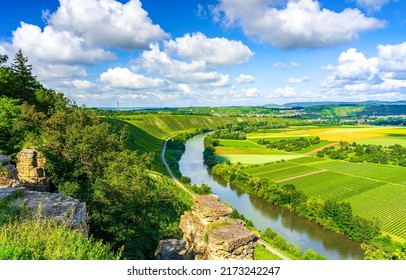 A river in a green valley in summer. Summer river valley panorama. Summer river landscape. River valley in summer - Shutterstock ID 2173242247