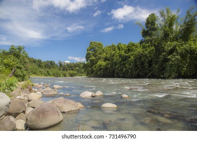 River In Kota Belud With Cloudy Sky, Malaysian Borneo.