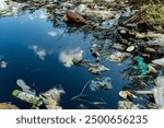 River or lake covered with floating garbage and plastic waste. Pollution from garbage causes water to become polluted. Environment pollution.