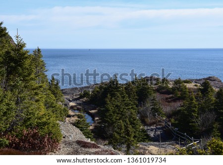 river landscape along the shoreline, East Coast trail, Stiles Cove Path near Flatrock Newfoundland Canada; early Spring 