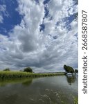 River Landscape with Dramatic Cloudy Sky