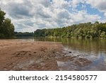 River landscape with sand bank appearing on the shore at low water levles. River Tisza, Hungary