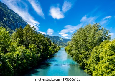 River and mountains with blue sky - Interlaken, Switzerland - Shutterstock ID 1936666435