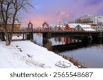 River Nidelva and The Old Bridge in Trondheim, covered with snow after snowfall