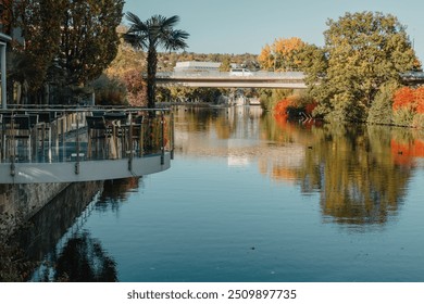 River On Sunset. Townhouses Buildings And Multi-floor Home At Waterfront. Sunset On River In City. Suburb Houses And Residential Building Near River In Europe. House In Nature On Shore On Sunset. - Powered by Shutterstock