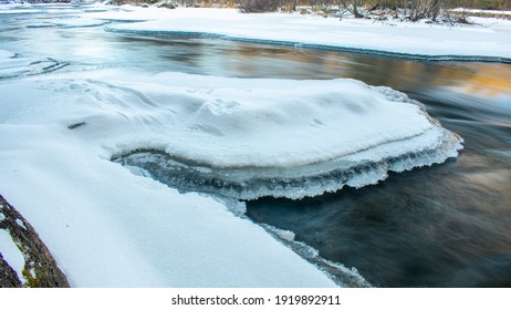 A River Otter Slide Leading Into Trout Waters In Northern Wisconsin. 