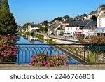 River Oust seen from bridge, part of canal Nantes at Brest, and flowers at Josselin, a commune in the Morbihan department in Brittany in north-western France