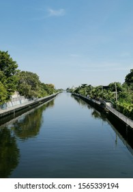 river with​ a​ path on​ the​ side