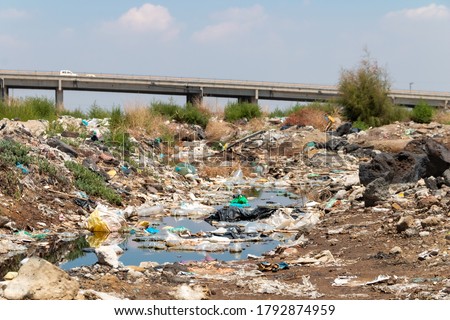 River polluted by plastic waste. Pollution concept. Recycling. Global warming