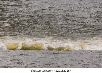 River Rapid Water Section With Ripples And Wave On The Surface