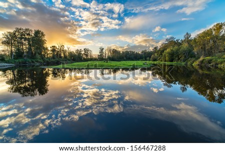 River reflection of clouds over wide angle.