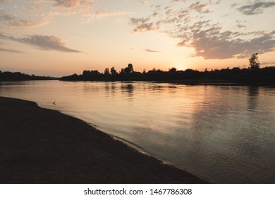 river reflection during sunset and clouds