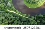 A river right near the castle of Turaida in Latvia! A great drone image with crocodile-like road detail.