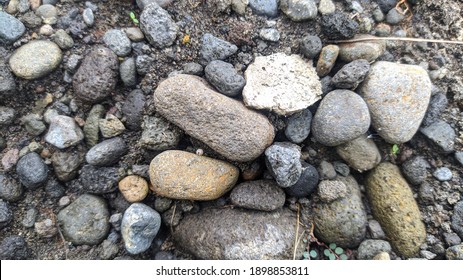 River rock stack with grey sand - Shutterstock ID 1898853811