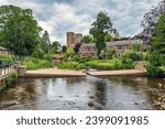 The River Skell in Ripon, with the cathedral standing majestically beyond, in the borough of Harrogate, North Yorkshire