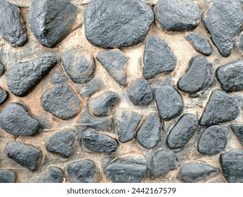 river stones arranged as wall decoration